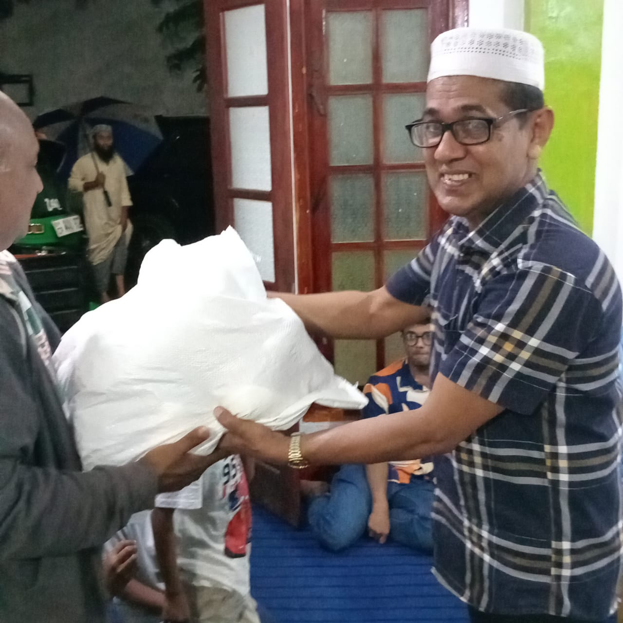A Ramadan food pack being presented to a community member