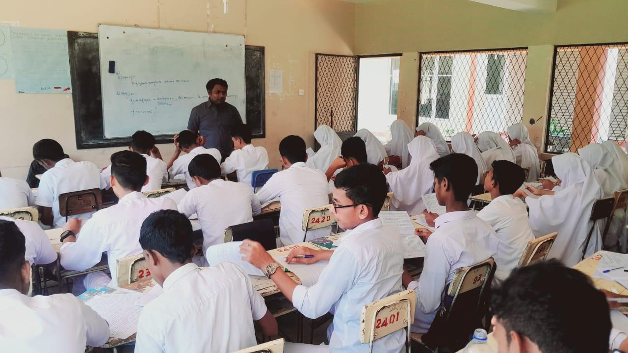 Students following the Tamil lesson