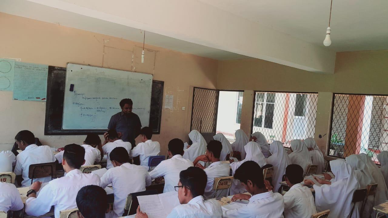 Students completing Tamil exercises